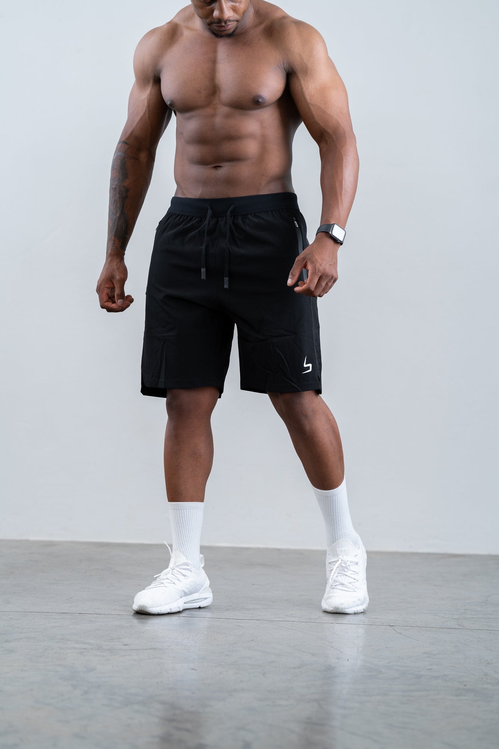 man wearing botthms black training sport short