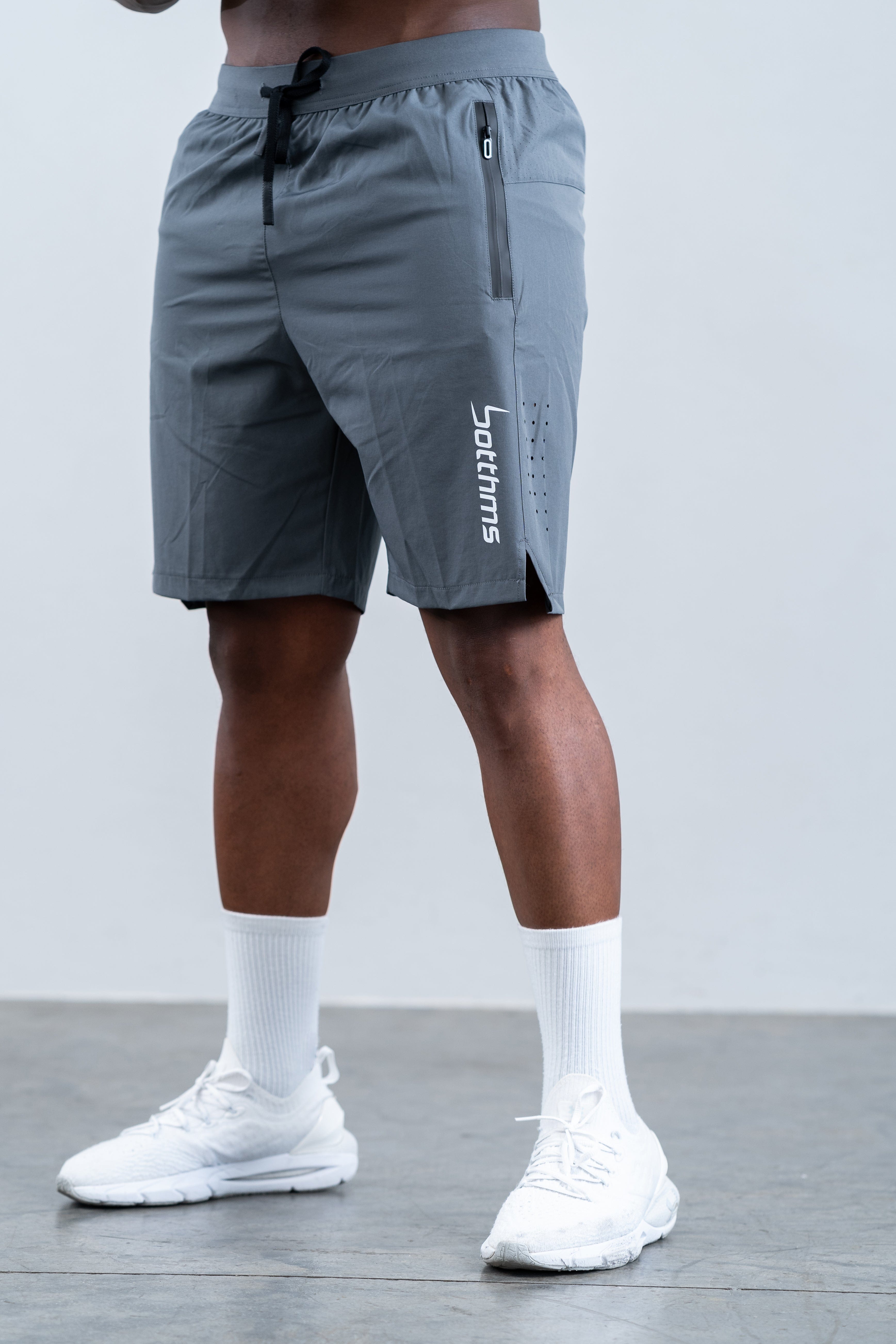 man wearing botthms gray training sport short