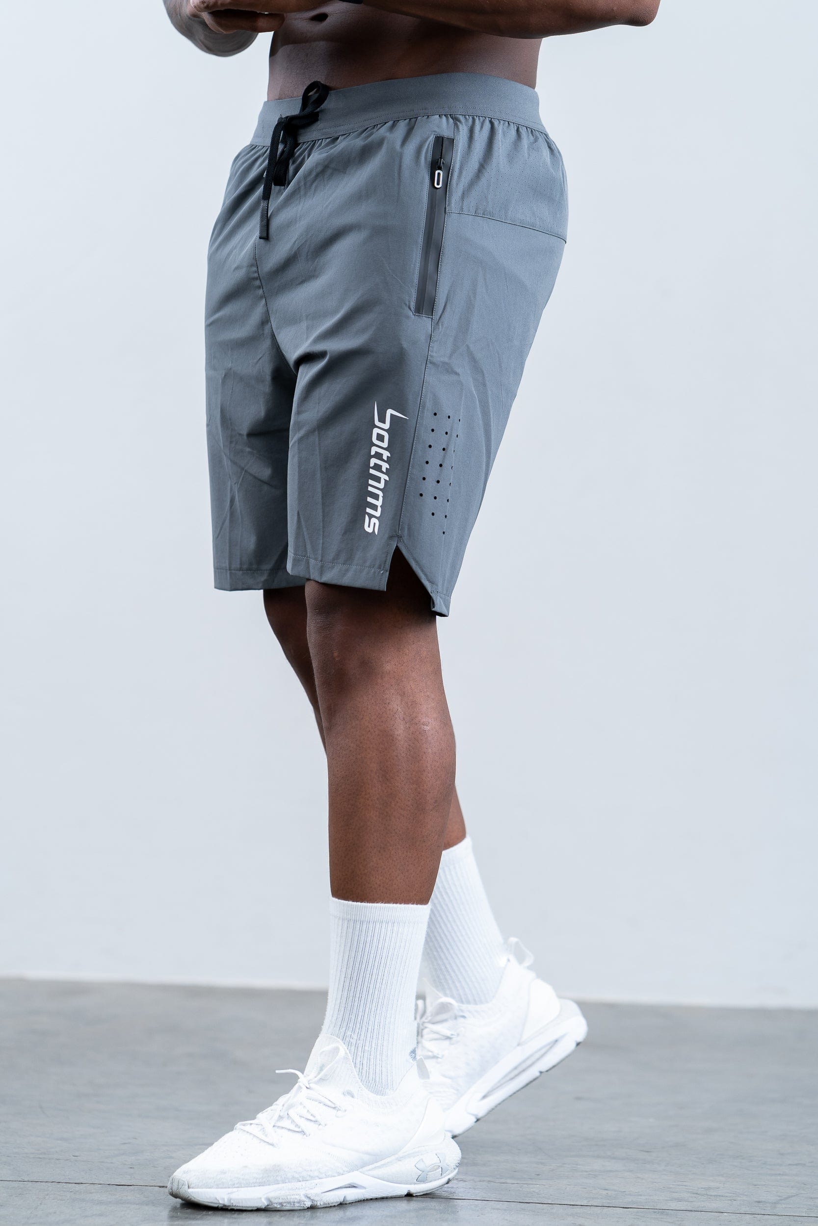 man wearing botthms gray training sport short