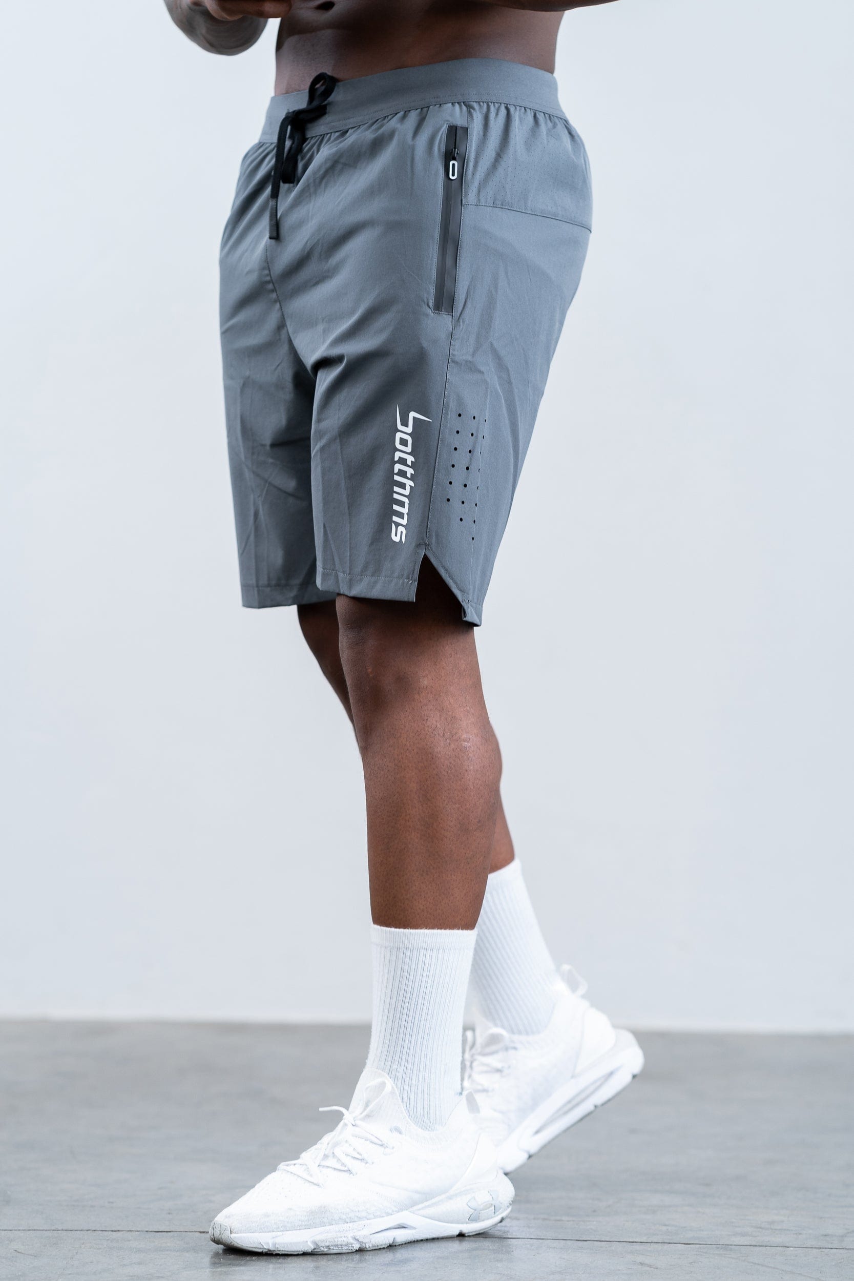 man wearing botthms gray training sport short