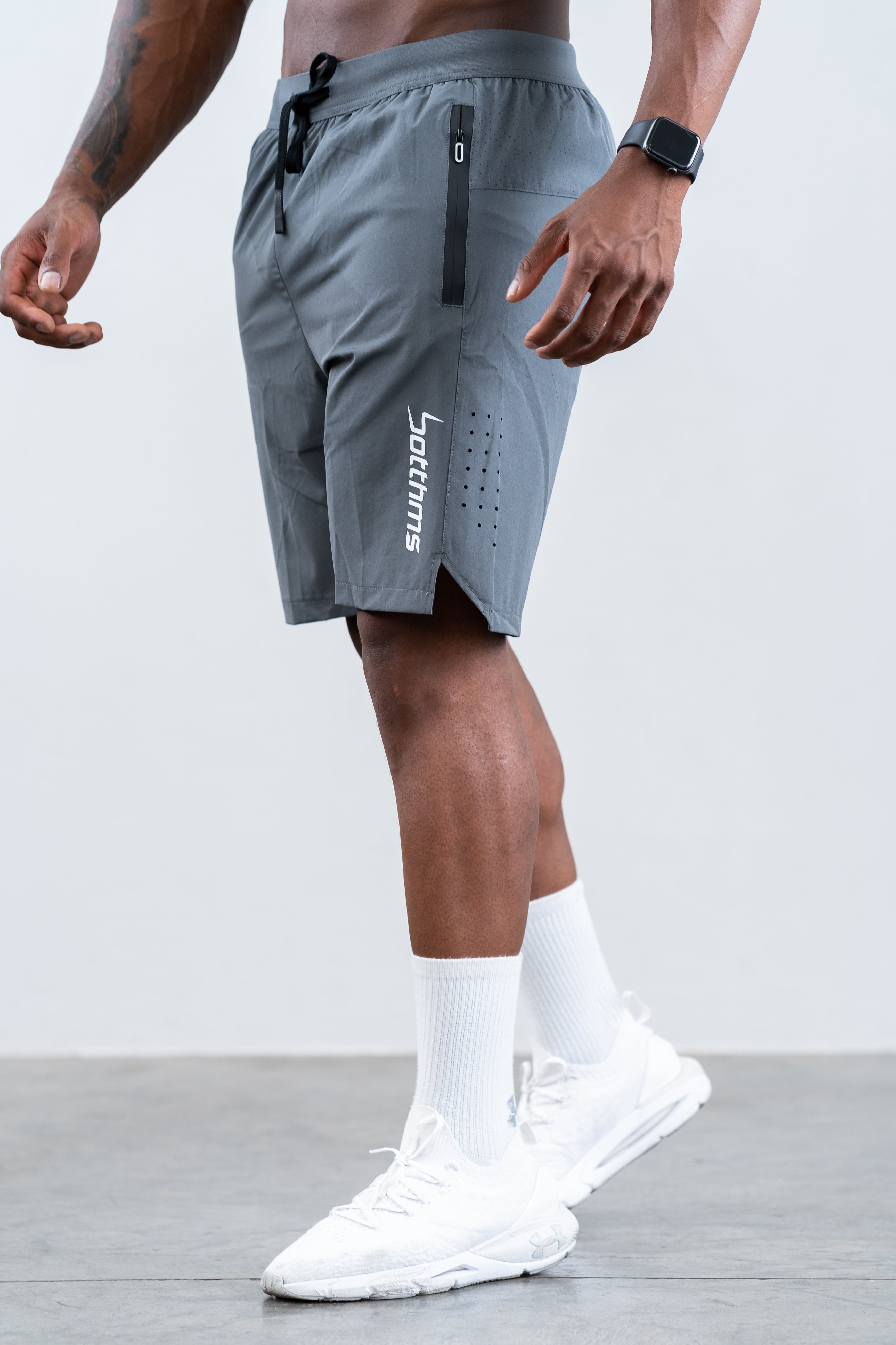 man wearing botthms gray training sport short