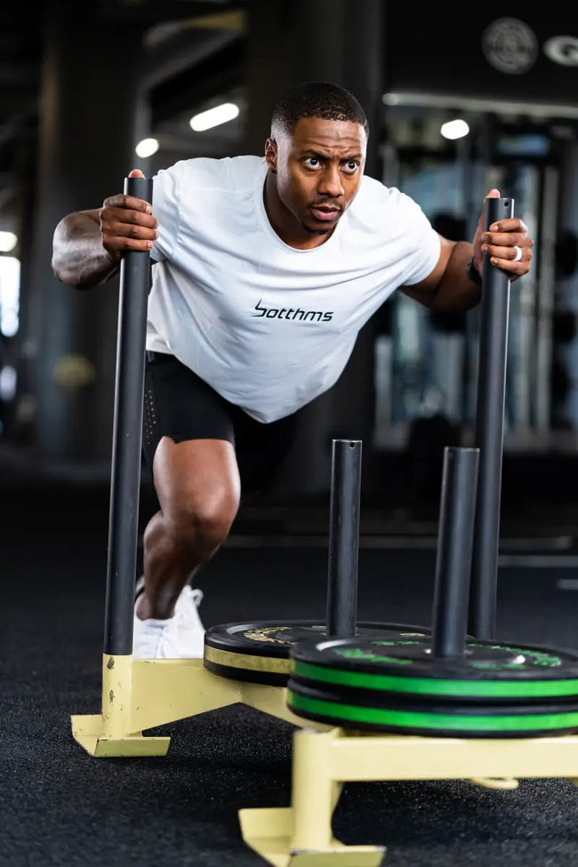 Male athlete doing workout wearing botthms active wear