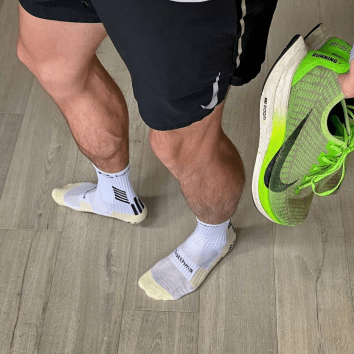 man wearing botthms grip socks