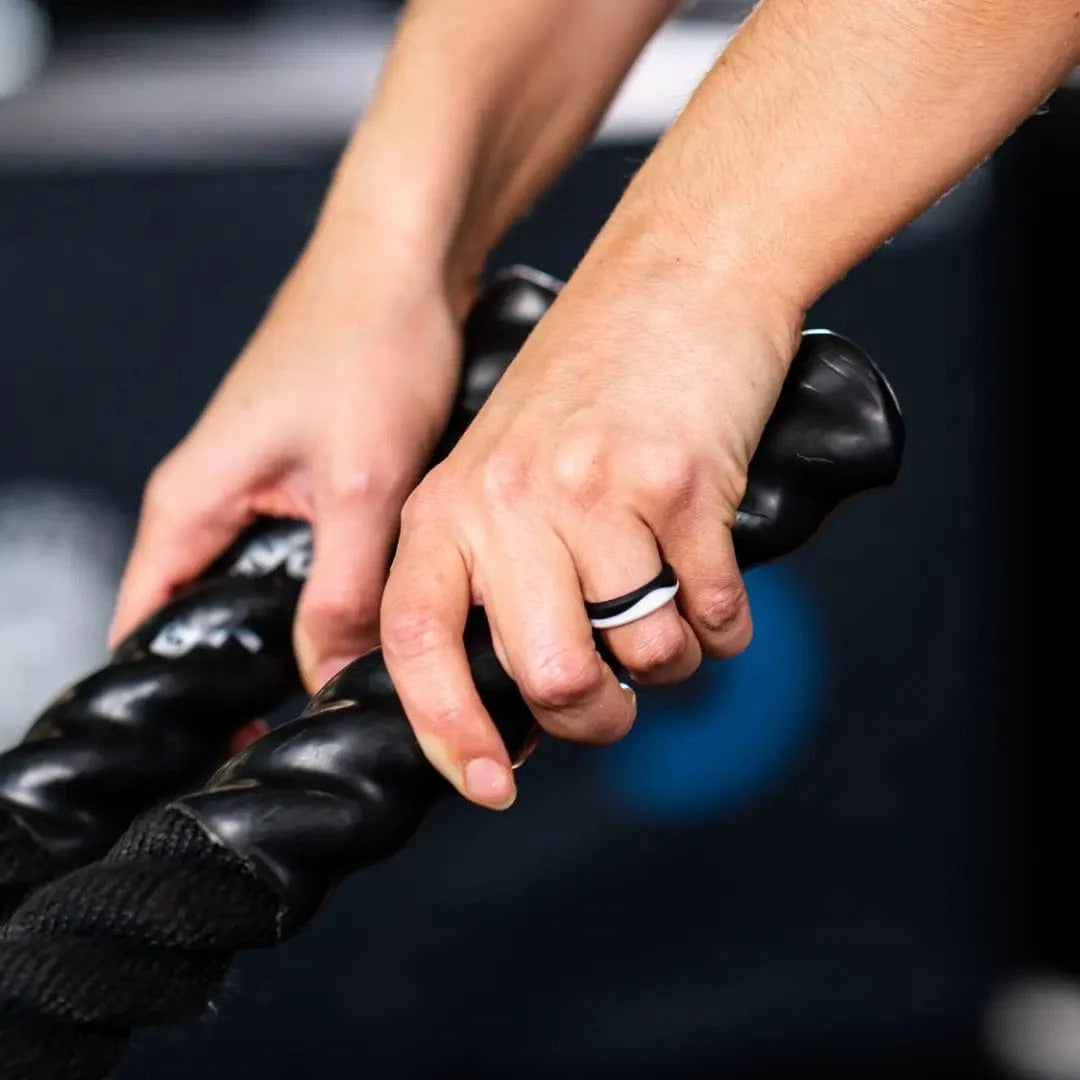 Hand wearing botthms silicone ring