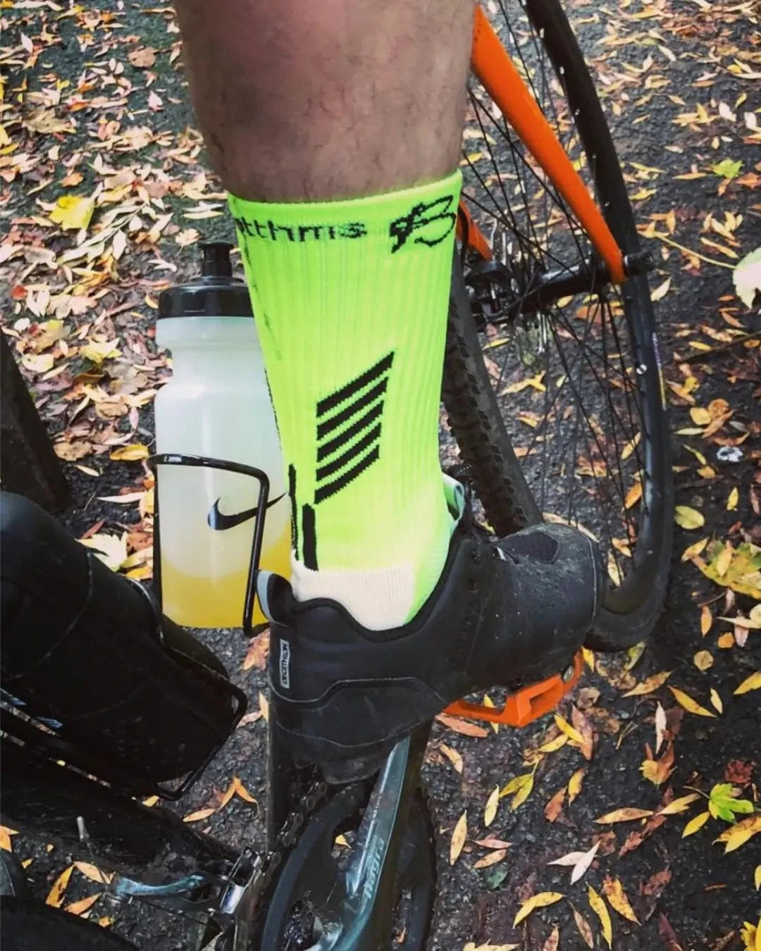 A foot on bicycle wearing botthms grip sock