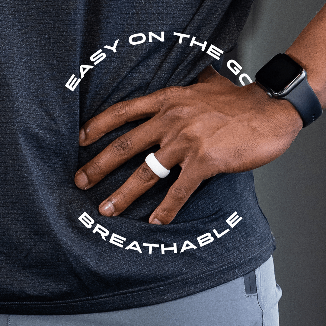 man wearing white silicone ring in his finger